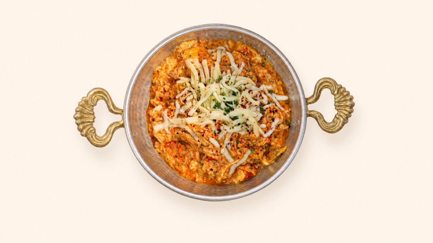 A pan of menemen, Turkish eggs cooked with tomato and green pepper, served bubbling at Cappadocia Cafe
